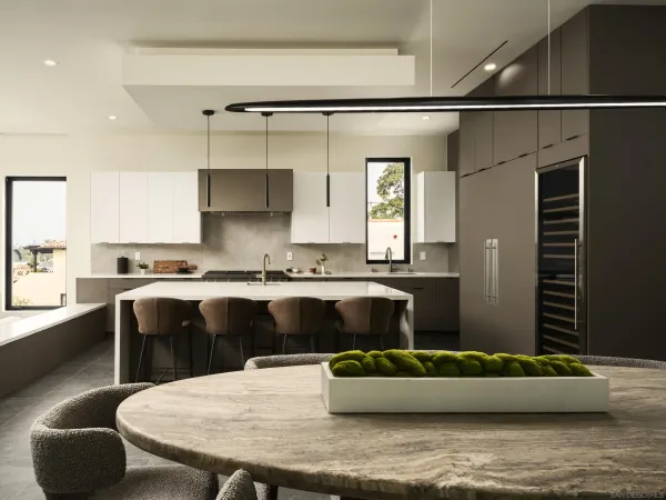 a kitchen with a table and chairs