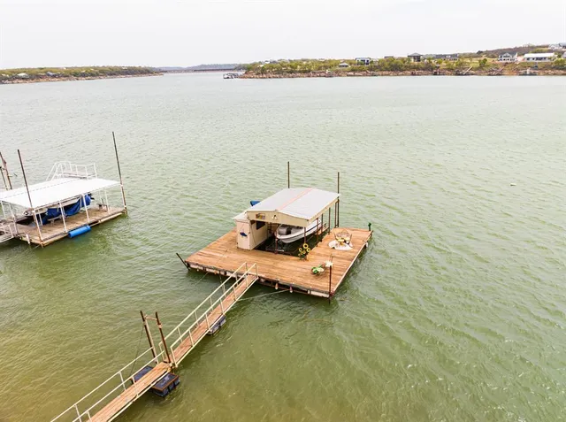 a bathroom with a sink a toilet and shower curtain