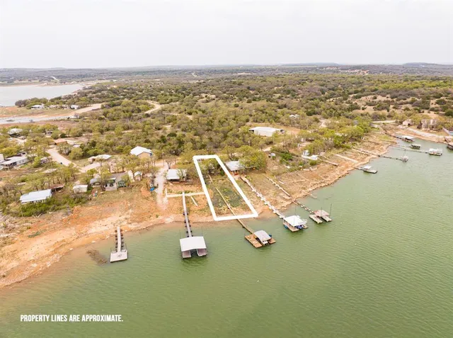a bathroom with a toilet and a shower curtain