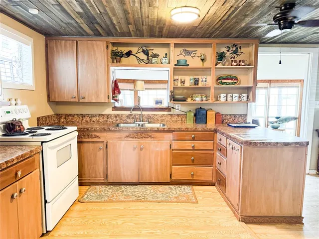 a bedroom with a bed table and window