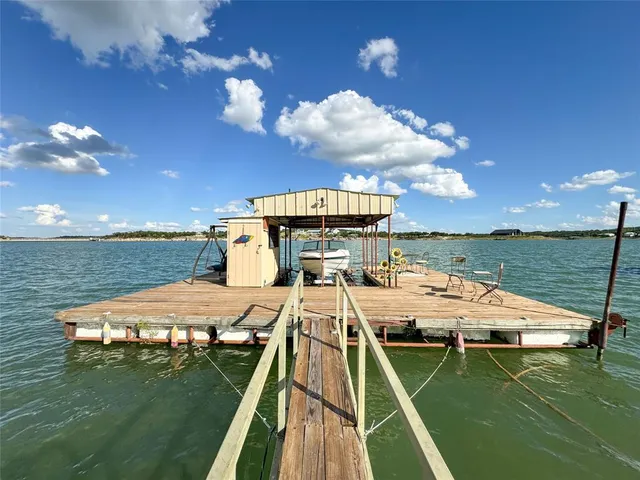 a view of a swimming pool with a table and chairs