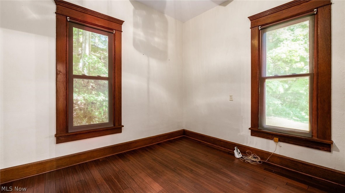 10755 Rural Dale Road Blue Rock, OH 43720 - Photo 17 of 27 Unfurnished room with dark wood-type flooring