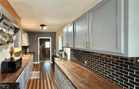 a view of a large room with wooden floor