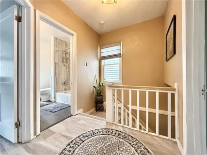 a bedroom with a bed and glass door