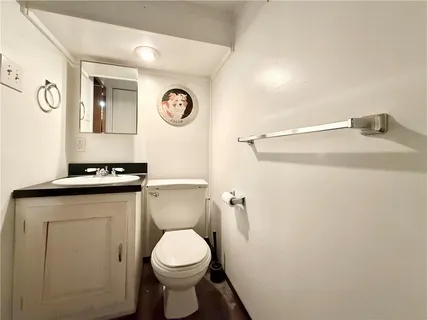 a bathroom with a toilet and a sink