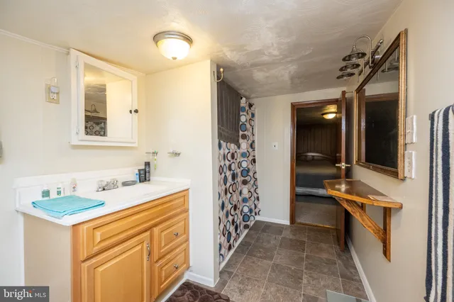 a room that has a bed and a mirror