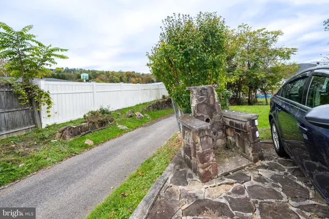 a view of a chair and table on the garden
