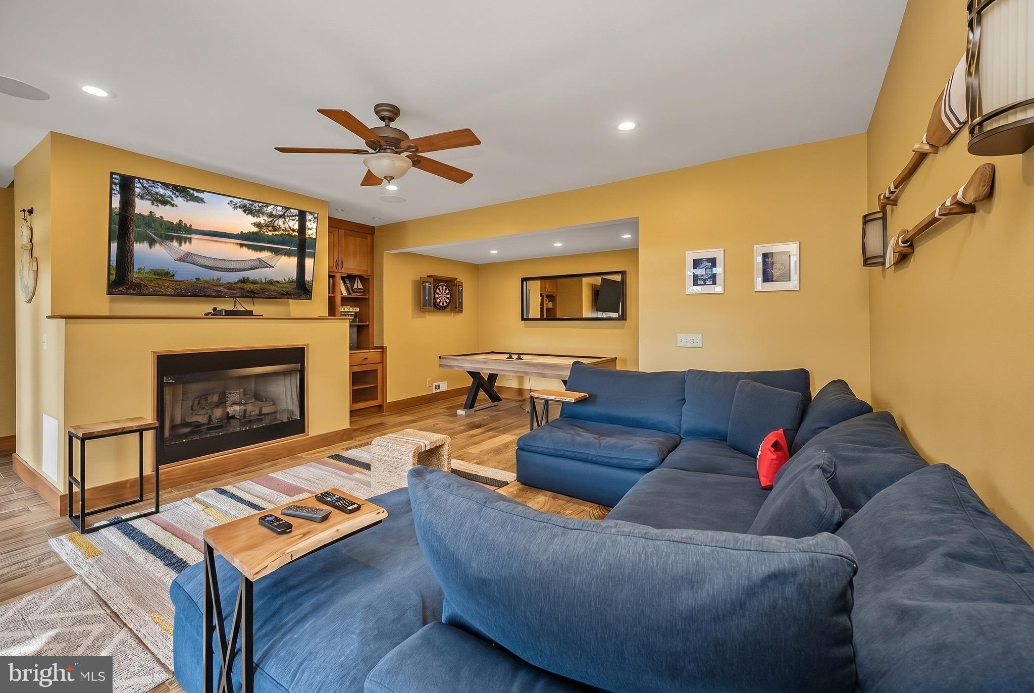 185 Ruta Lane Swanton, MD 21561 - Photo 36 of 81 a living room with furniture and a fireplace