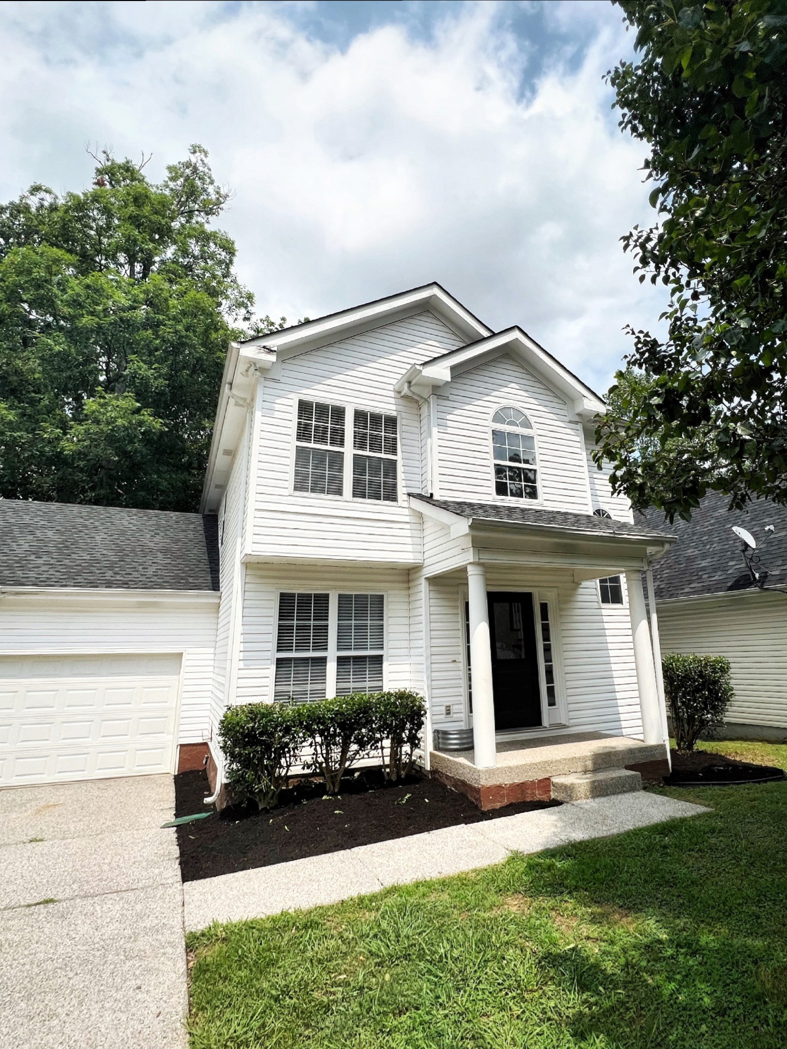 2817 Rader Ridge Court Antioch, TN 37013 - Photo 1 of 14 a front view of a house with yard and green space