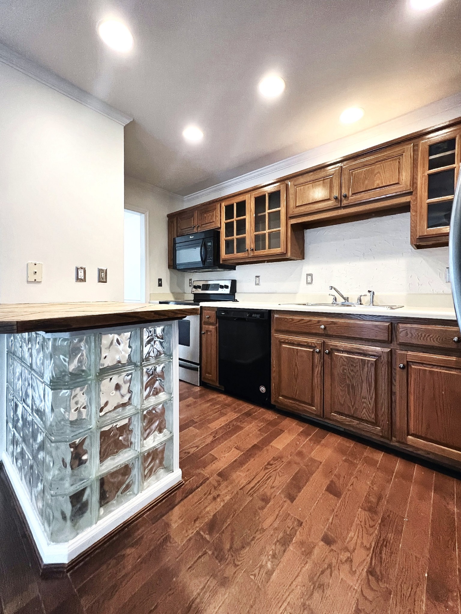 2817 Rader Ridge Court Antioch, TN 37013 - Photo 4 of 14 a kitchen with stainless steel appliances granite countertop a stove sink and cabinets
