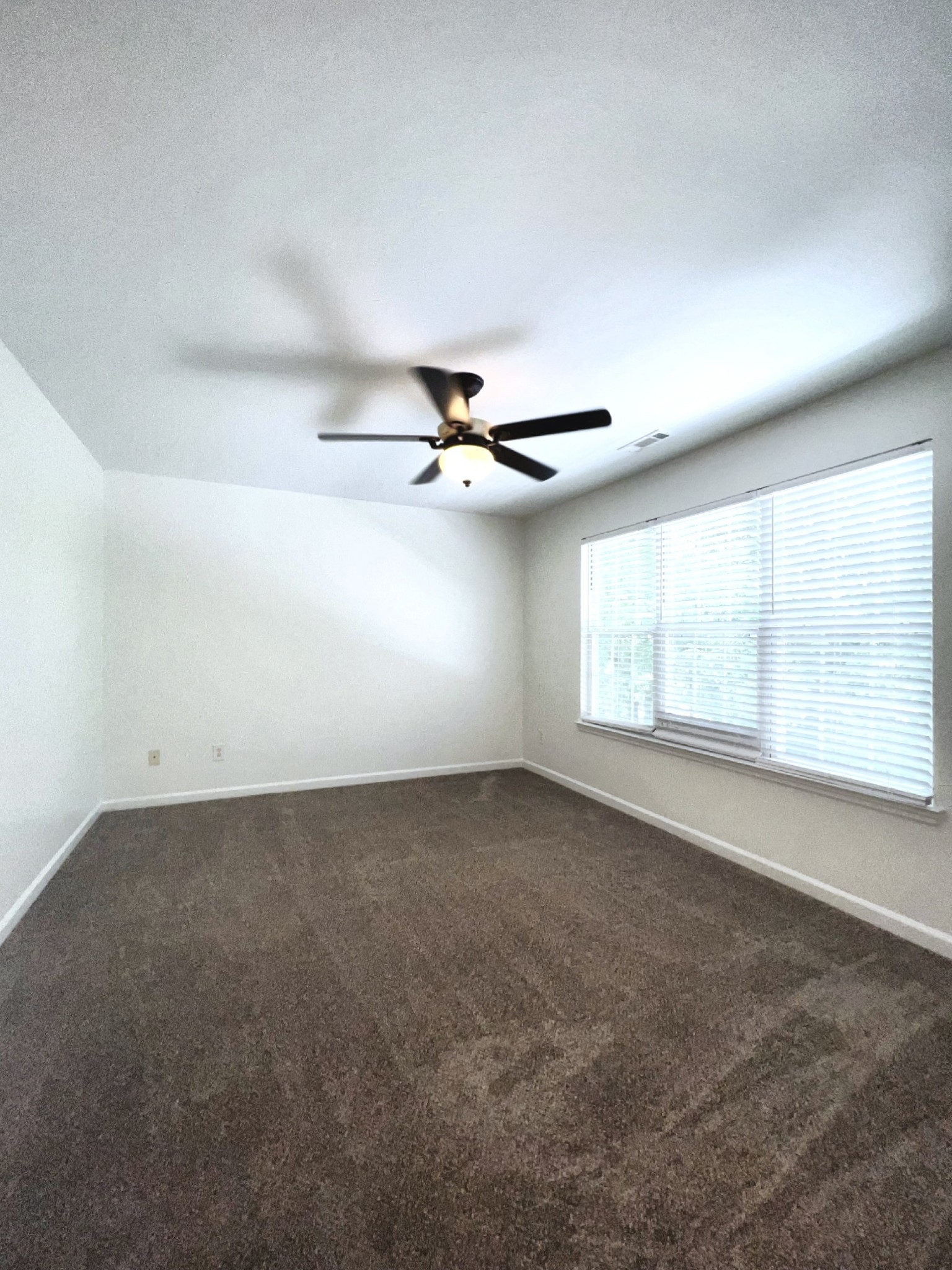 2817 Rader Ridge Court Antioch, TN 37013 - Photo 6 of 14 an empty room with windows and a ceiling fan