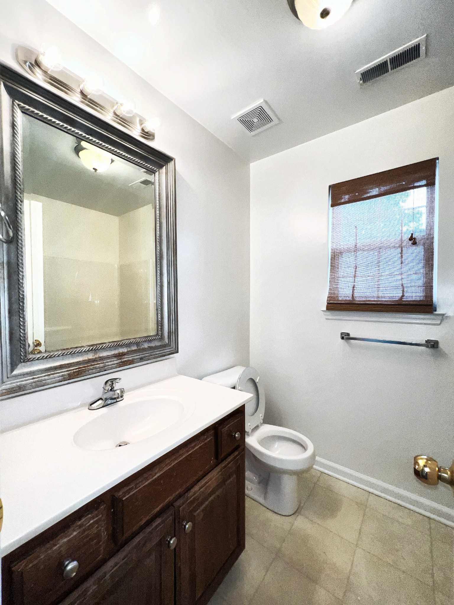 2817 Rader Ridge Court Antioch, TN 37013 - Photo 9 of 14 a bathroom with a double vanity sink mirror and toilet