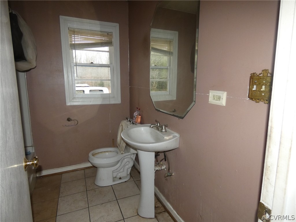 10309 Taylor Road Chesterfield, VA 23838 - Photo 16 of 16 a bathroom with a sink toilet and a window