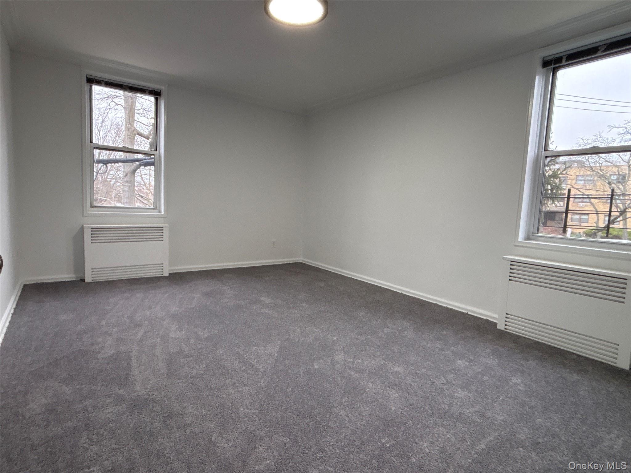 50 South Middle Neck Road, Unit 1P Great Neck, NY 11021 - Photo 16 of 22 Second bedroom with brand new carpet