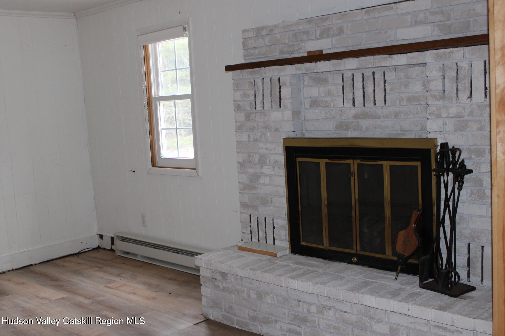 477 Campbell Road Windham, NY 12496 - Photo 16 of 45 a view of an empty room with wooden floor and a window