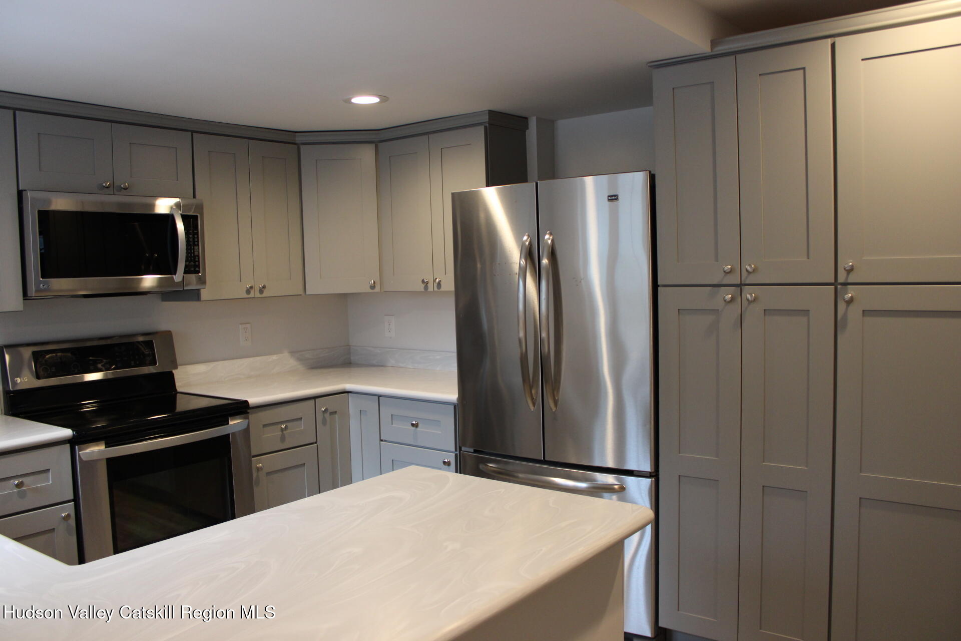 477 Campbell Road Windham, NY 12496 - Photo 19 of 45 a kitchen with stainless steel appliances a refrigerator a stove a microwave and cabinets