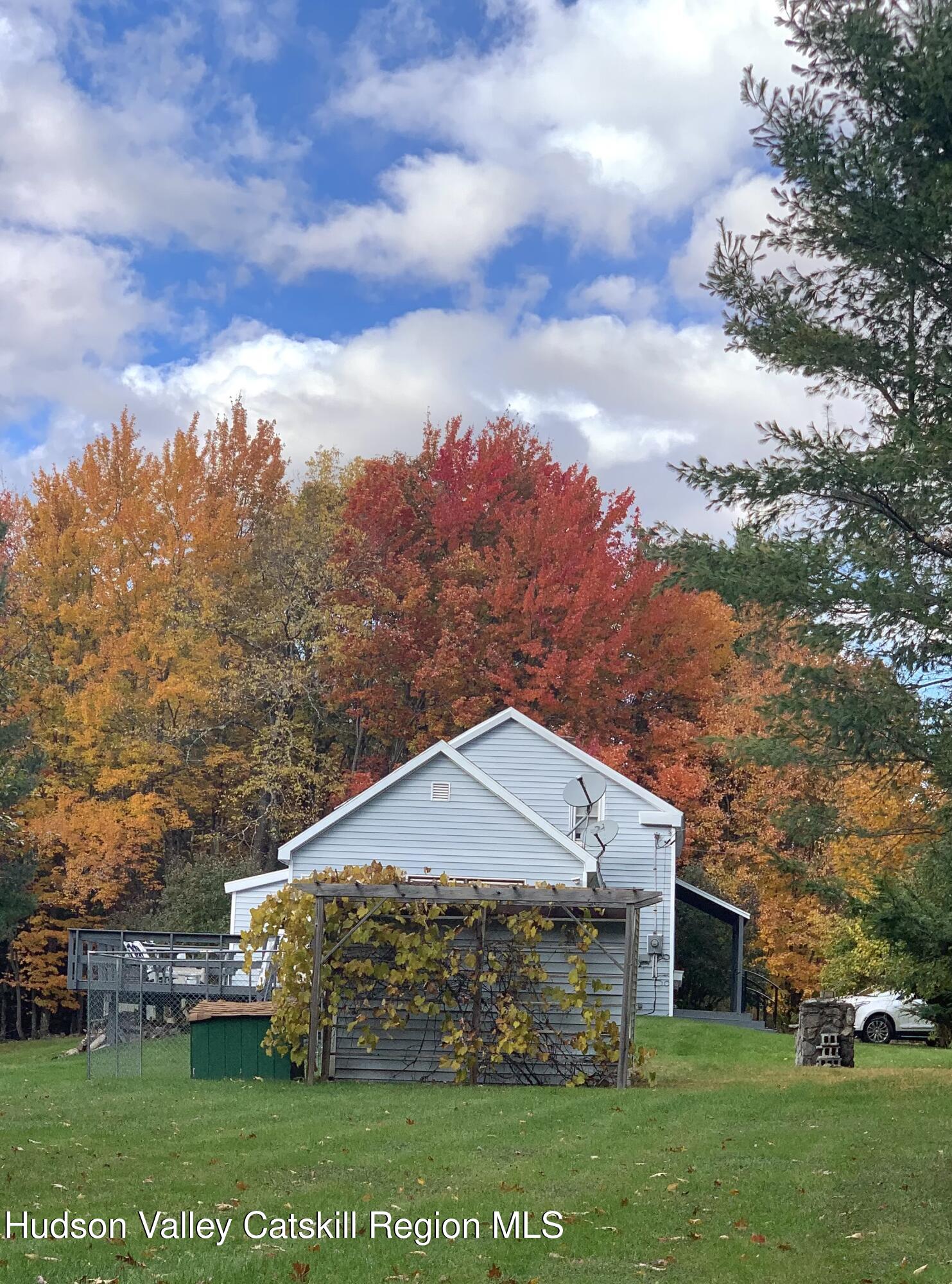 477 Campbell Road Windham, NY 12496 - Photo 2 of 45 a front view of a house with a garden