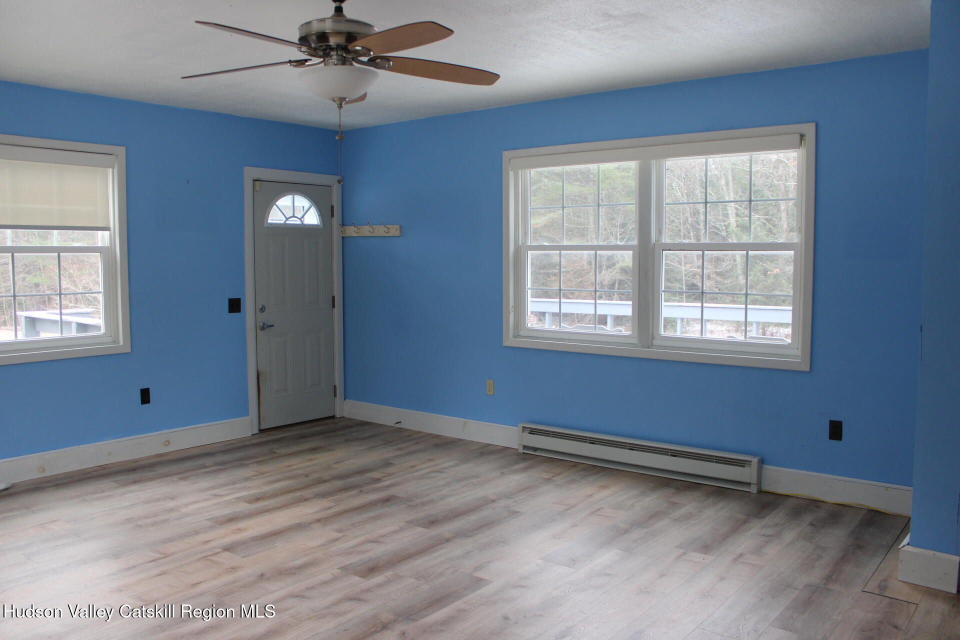 477 Campbell Road Windham, NY 12496 - Photo 21 of 45 a view of empty room with wooden floor and fan