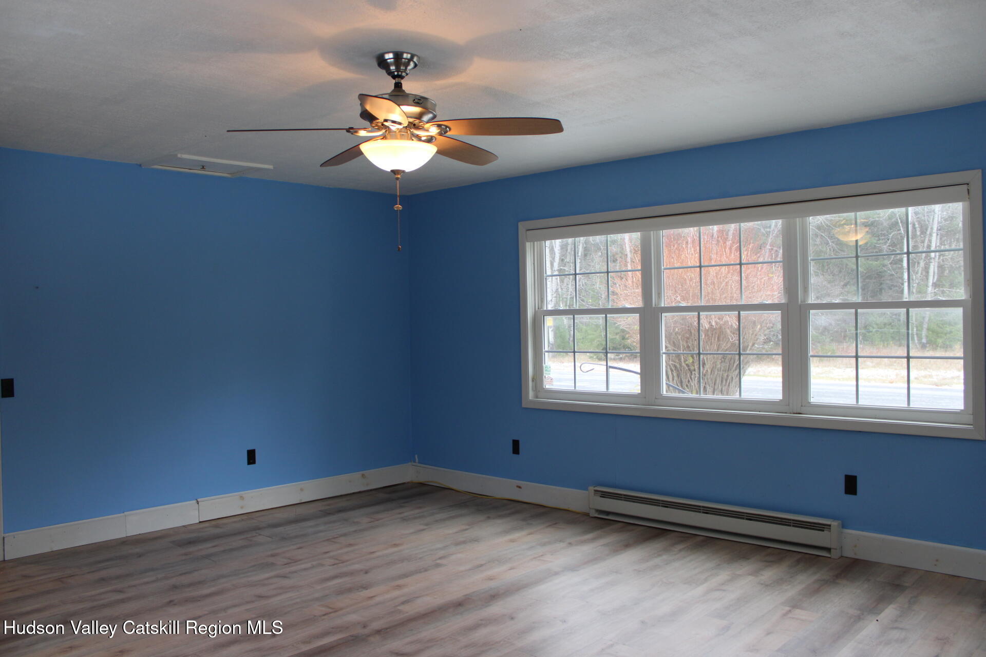 477 Campbell Road Windham, NY 12496 - Photo 22 of 45 wooden floor in an empty room with a window
