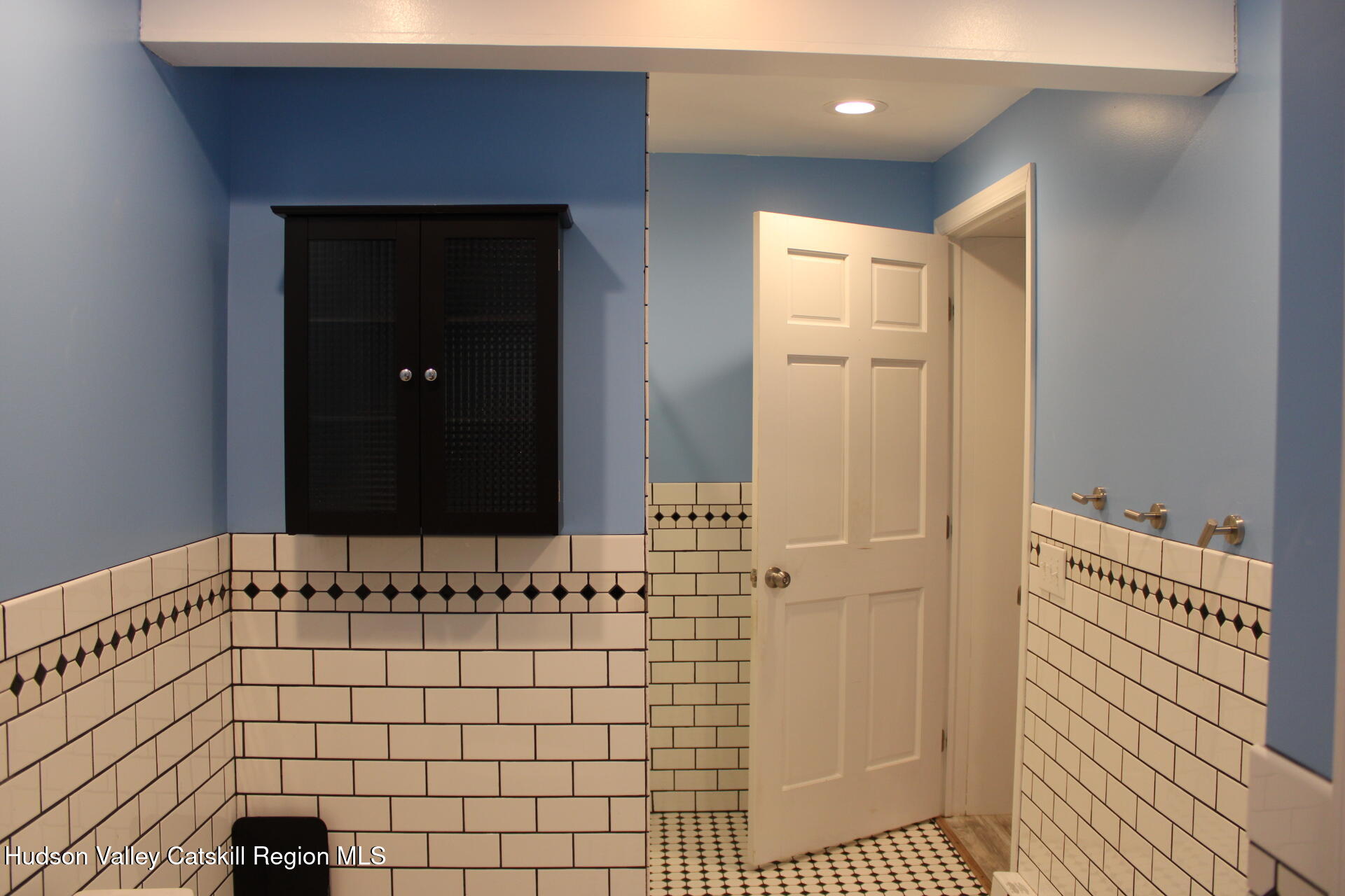 477 Campbell Road Windham, NY 12496 - Photo 23 of 45 a bathroom with a sink and a mirror