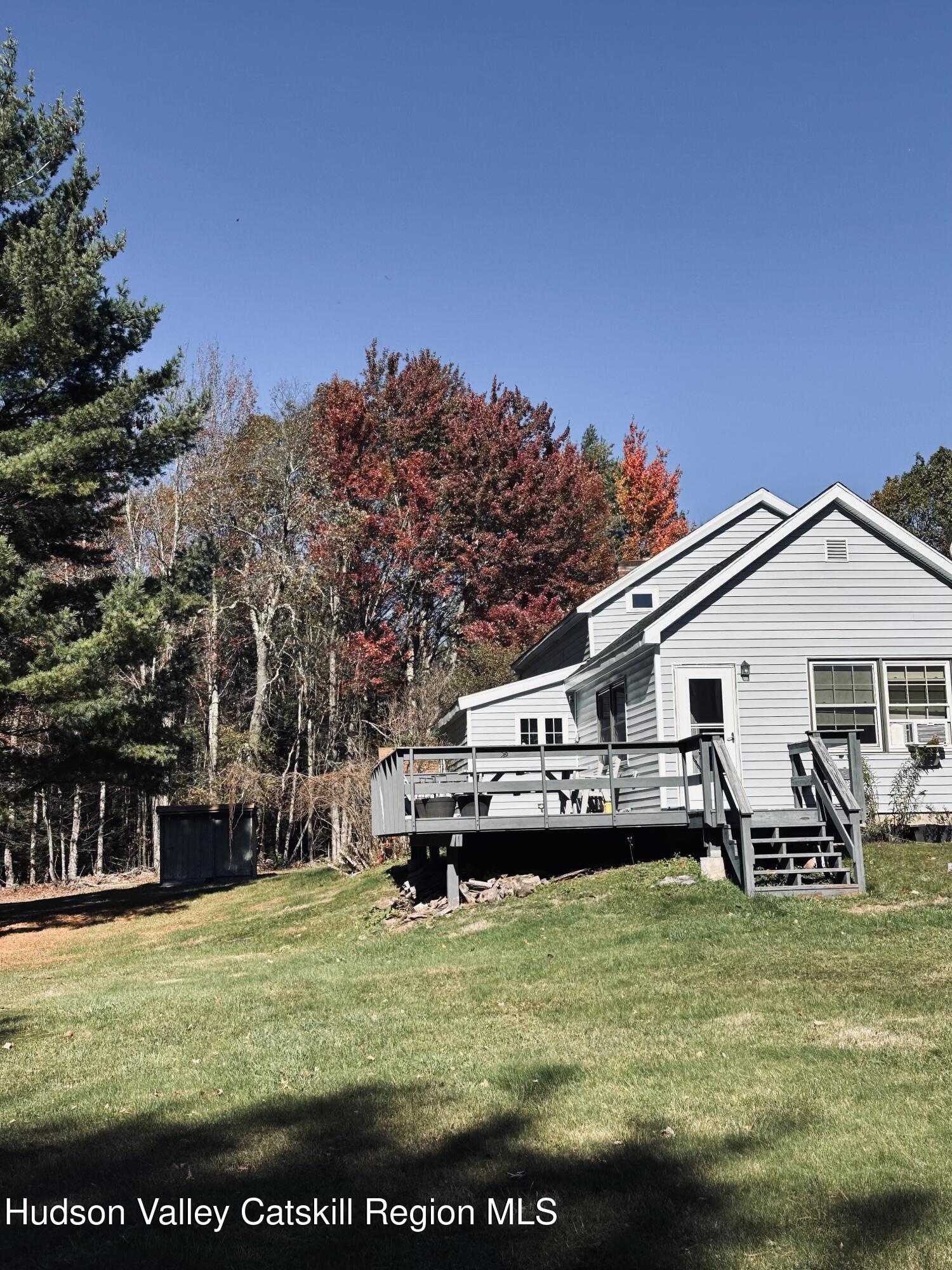 477 Campbell Road Windham, NY 12496 - Photo 45 of 45 a view of a house with swimming pool and sitting area