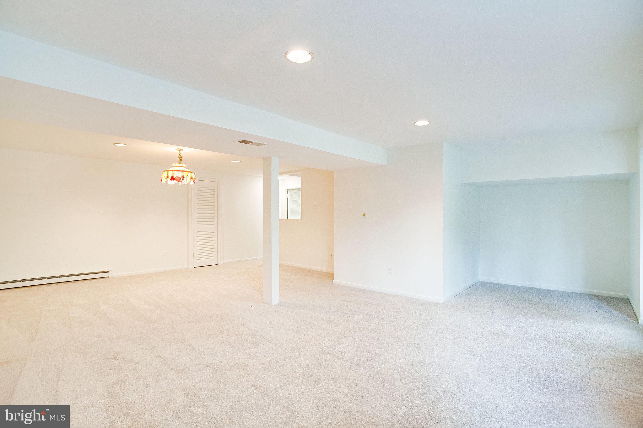 12220 St James Road Potomac, MD 20854 - Photo 47 of 69 Lower-level rec room with recessed lighting