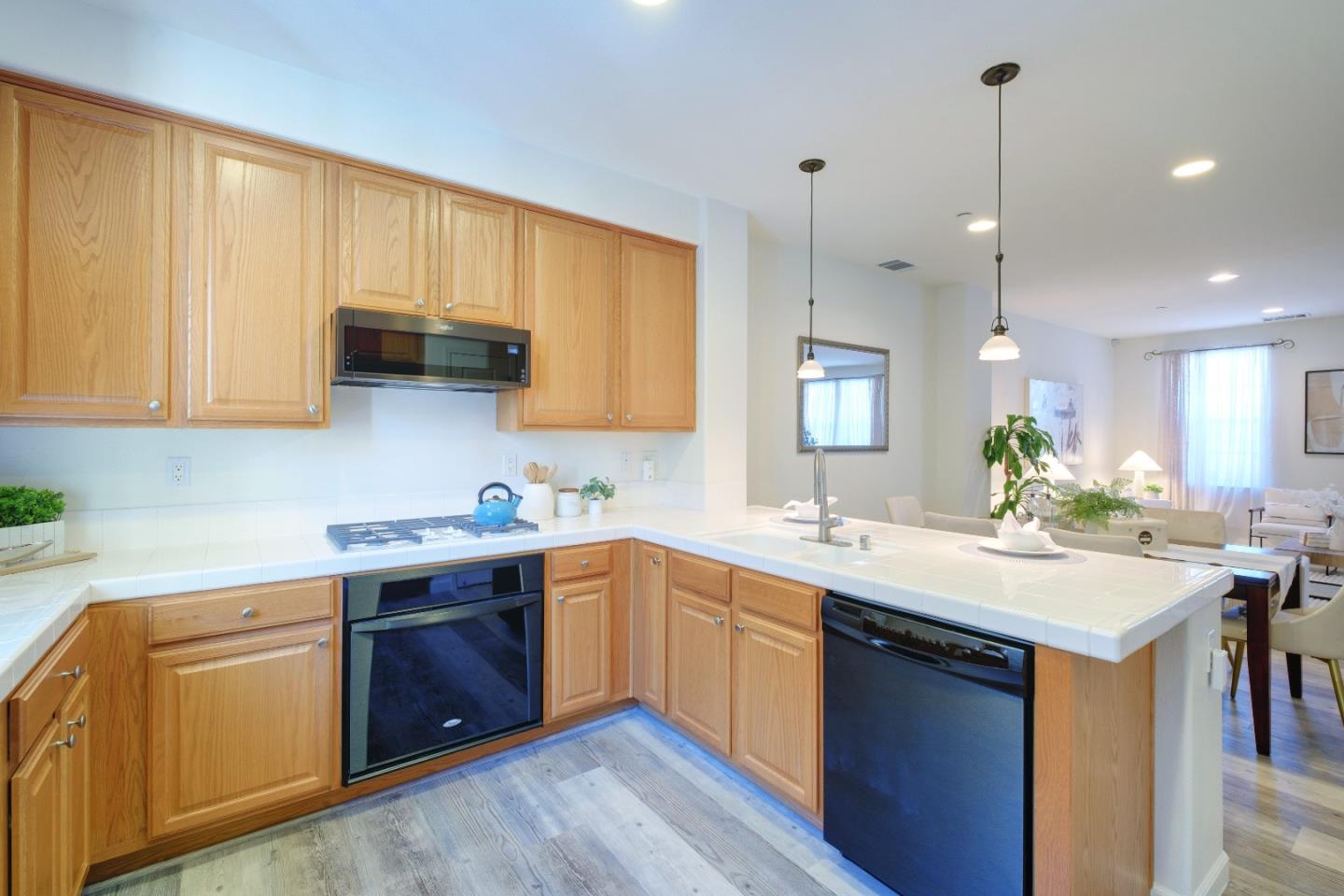 738 Claridad Loop Milpitas, CA 95035 - Photo 17 of 53 a kitchen with a sink stove and cabinets