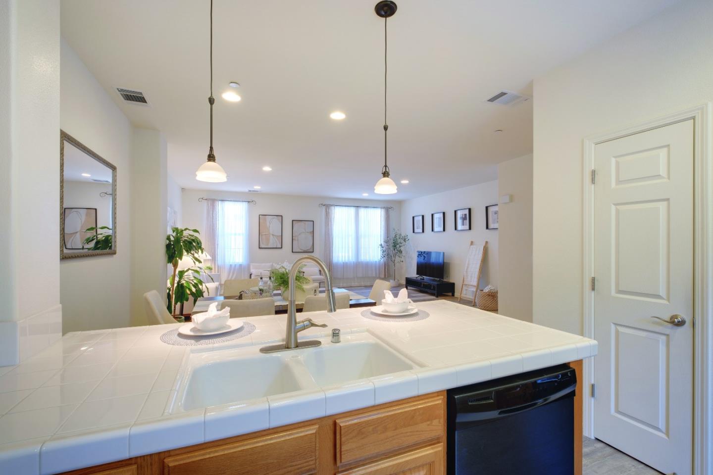738 Claridad Loop Milpitas, CA 95035 - Photo 20 of 53 a view of a kitchen counter space a sink and living room view