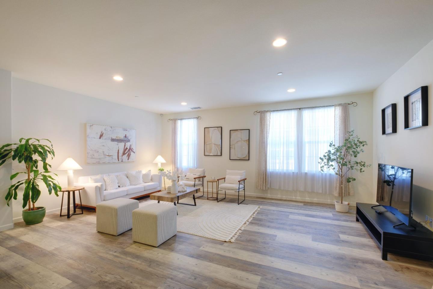 738 Claridad Loop Milpitas, CA 95035 - Photo 2 of 53 a living room with furniture and a wooden floor