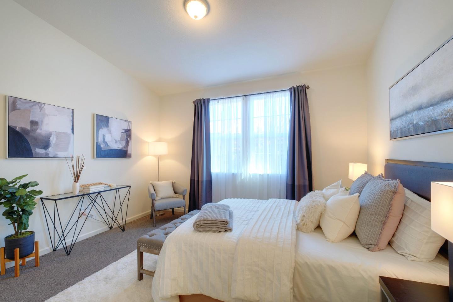 738 Claridad Loop Milpitas, CA 95035 - Photo 23 of 53 a bedroom with a bed and a table