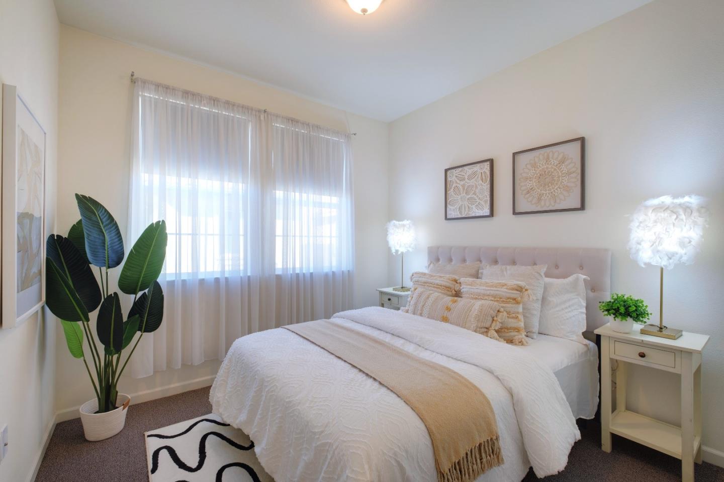 738 Claridad Loop Milpitas, CA 95035 - Photo 26 of 53 a bedroom with a bed and a potted plant