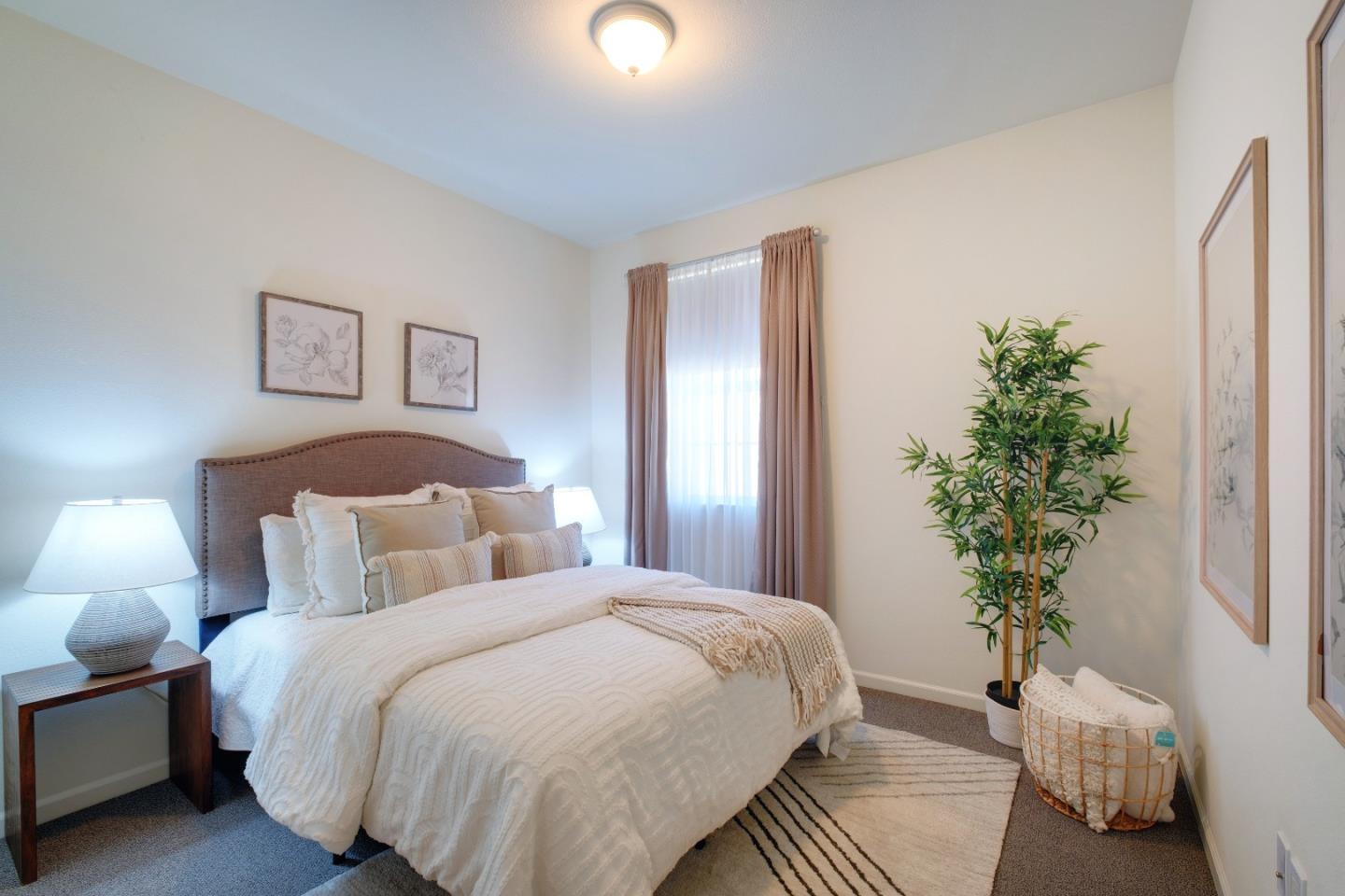 738 Claridad Loop Milpitas, CA 95035 - Photo 28 of 53 a bedroom with bed and a potted plant