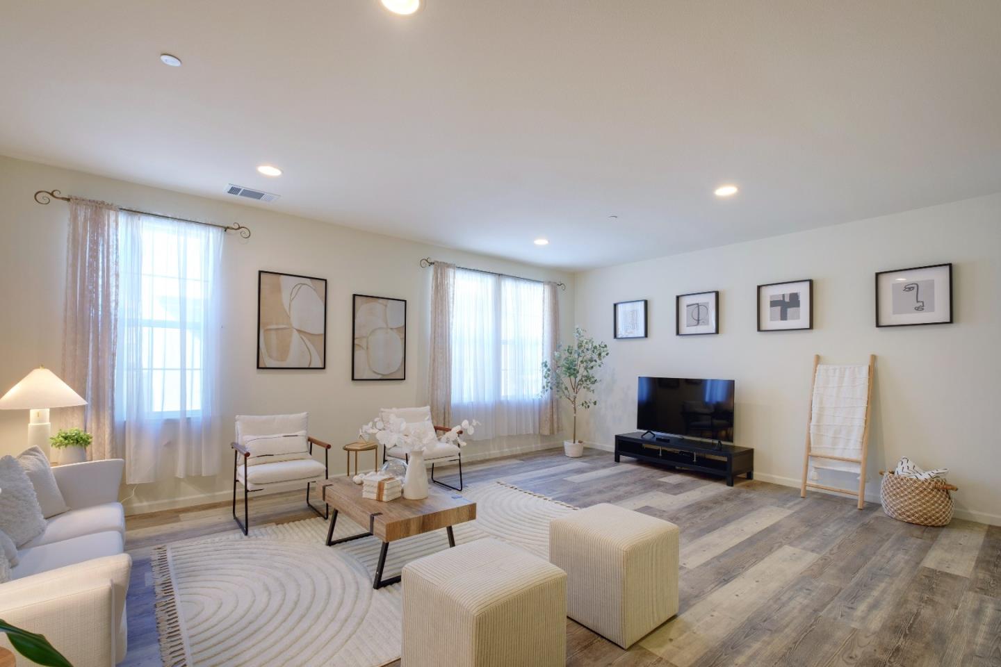 738 Claridad Loop Milpitas, CA 95035 - Photo 3 of 53 a living room with furniture a flat screen tv and a window