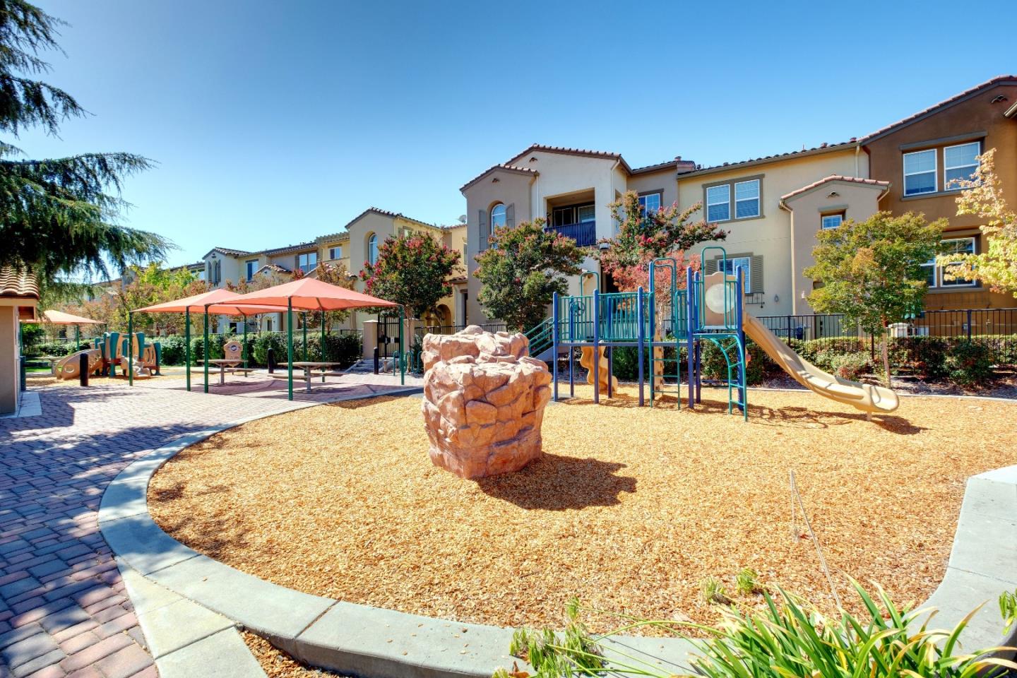 738 Claridad Loop Milpitas, CA 95035 - Photo 36 of 53 a view of a building with a swimming pool