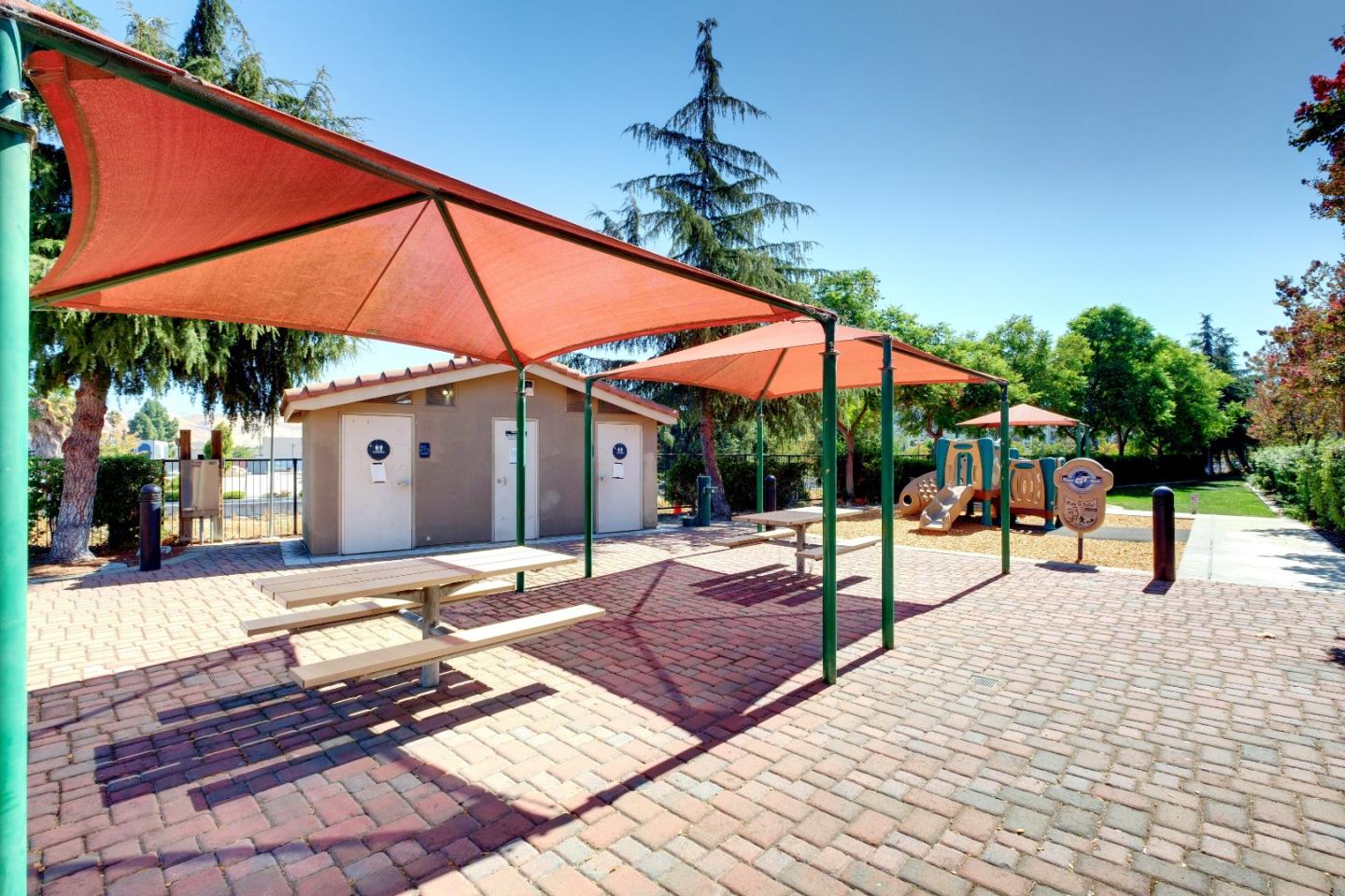 738 Claridad Loop Milpitas, CA 95035 - Photo 37 of 53 a view of patio with a table and chairs under an umbrella