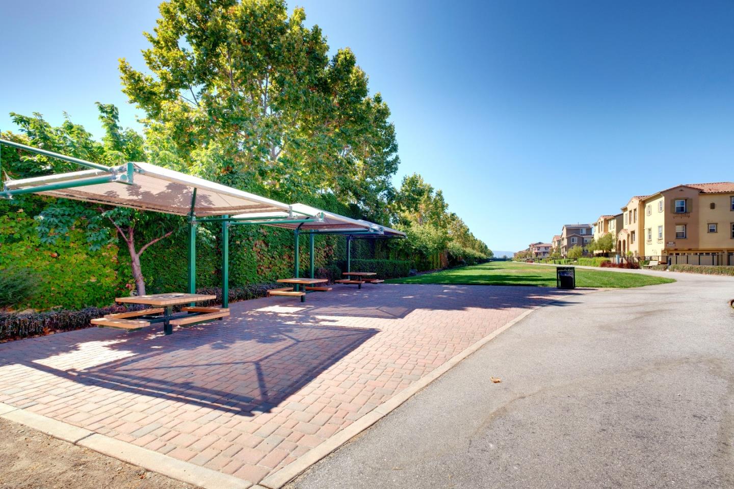 738 Claridad Loop Milpitas, CA 95035 - Photo 40 of 53 a view of a patio with a table and chairs under an umbrella
