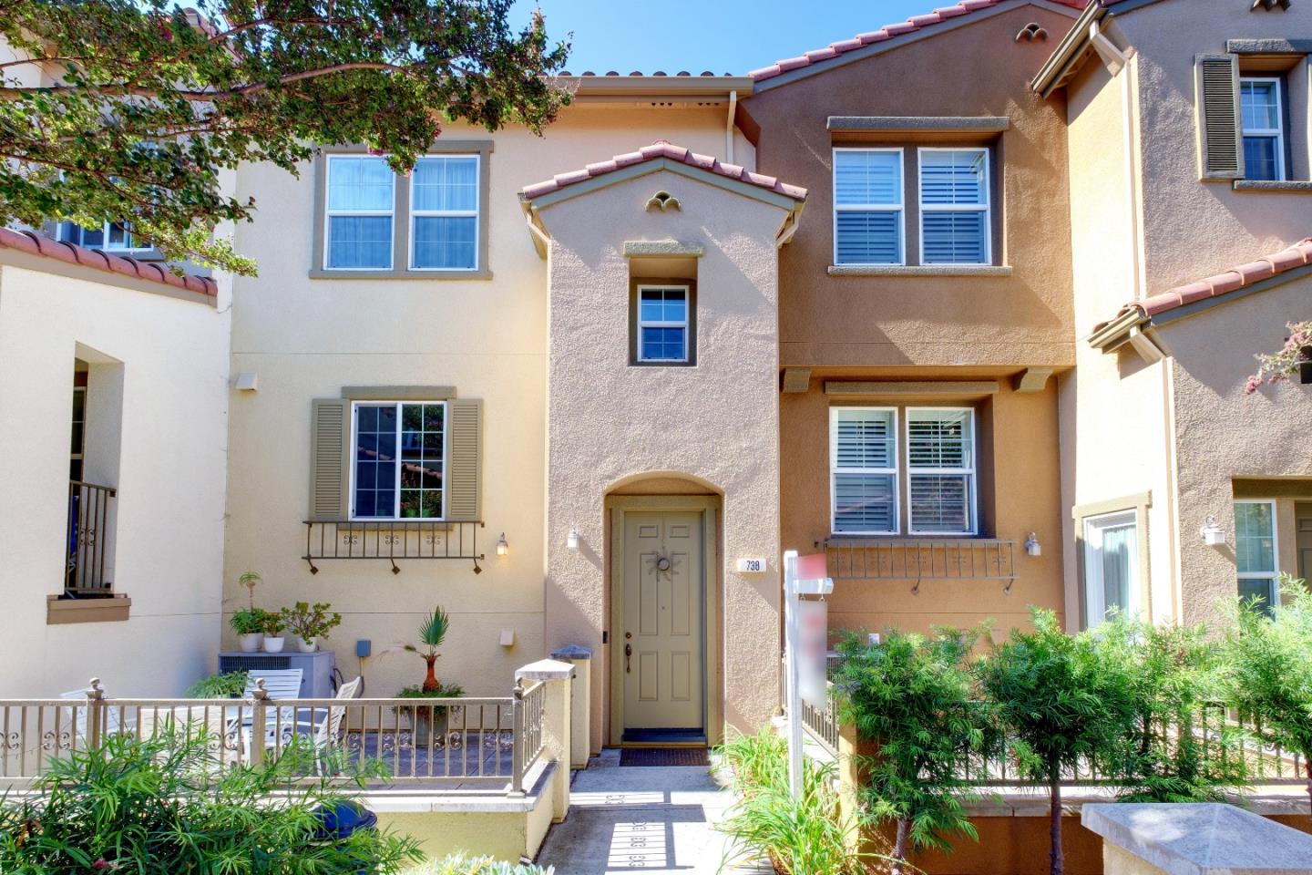 738 Claridad Loop Milpitas, CA 95035 - Photo 4 of 53 a front view of a house with outdoor seating and plants