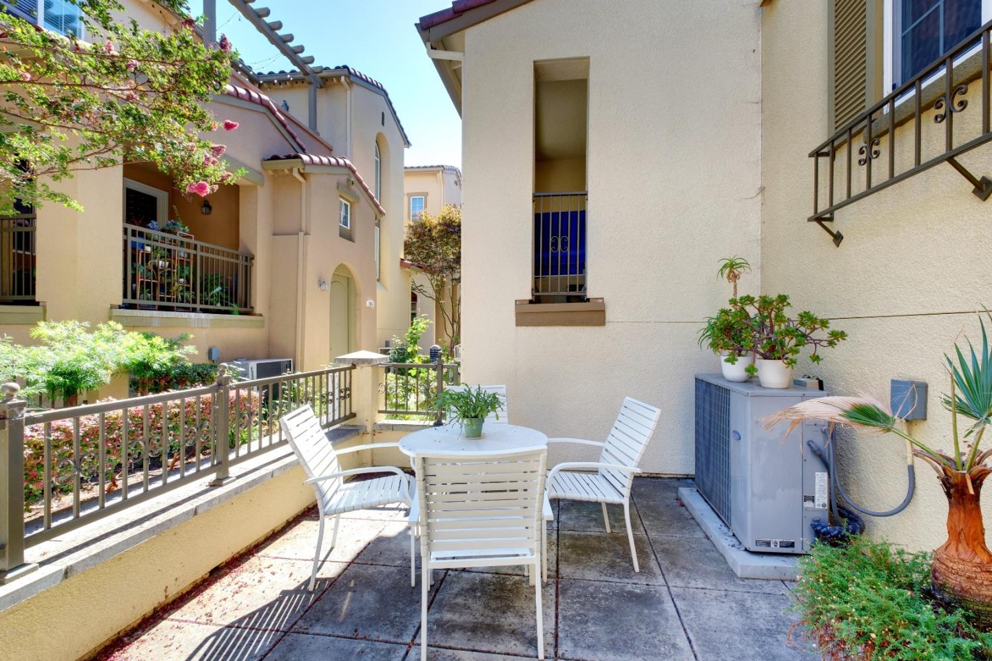 738 Claridad Loop Milpitas, CA 95035 - Photo 6 of 53 a dining area with furniture and flowers