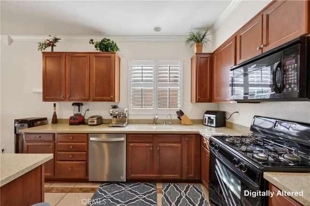 a kitchen with stainless steel appliances a sink stove and cabinets