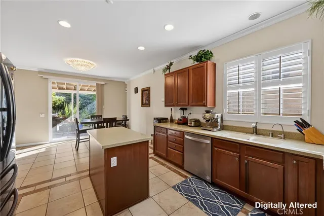 a kitchen with stainless steel appliances granite countertop a sink counter space cabinets and a window