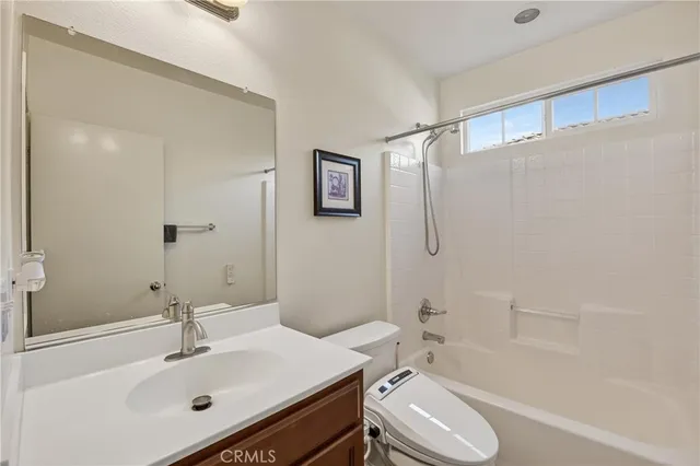 a bedroom with a bed and a table in it