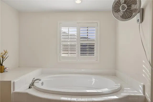 a spacious bathroom with a double vanity sink shower and a mirror