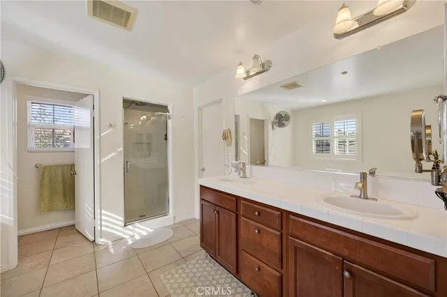 a view of the patio with a table and chairs under an umbrella