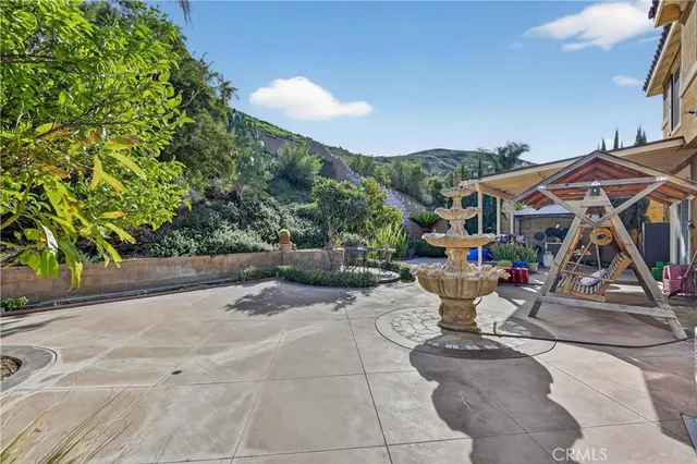 a view of a building with sitting area and furniture