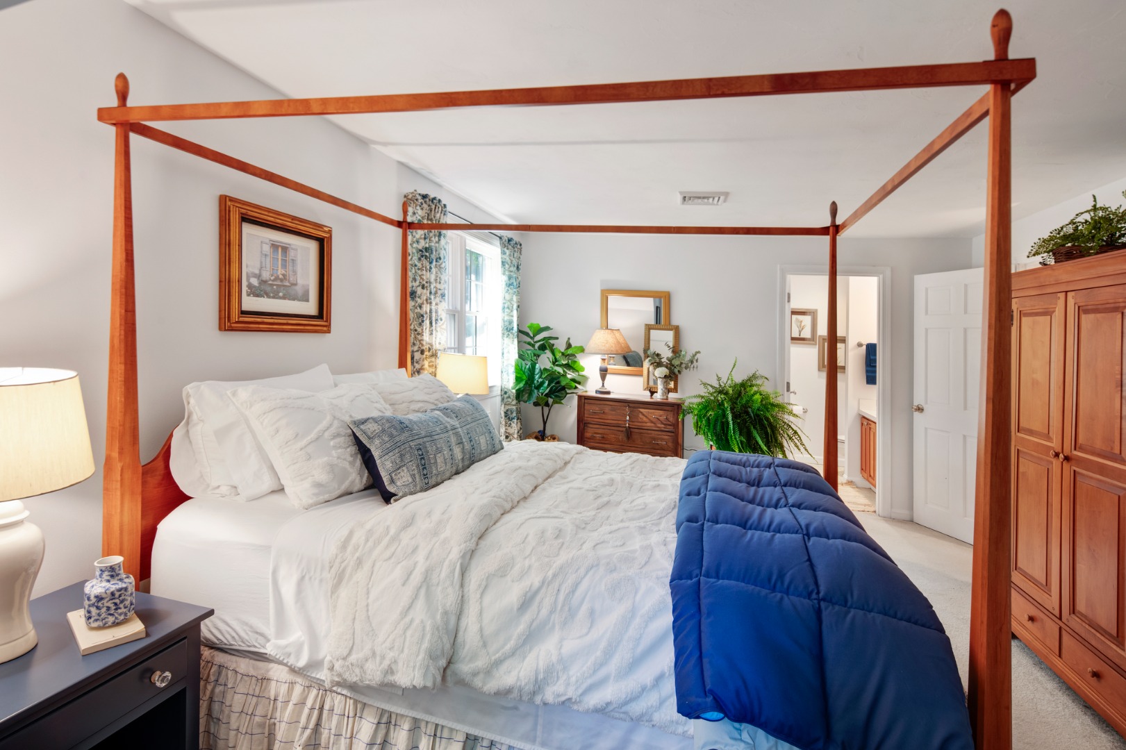 46 Bold Meadow Road Edgartown, MA 02539 - Photo 22 of 28 a bedroom with a large bed and a potted plant