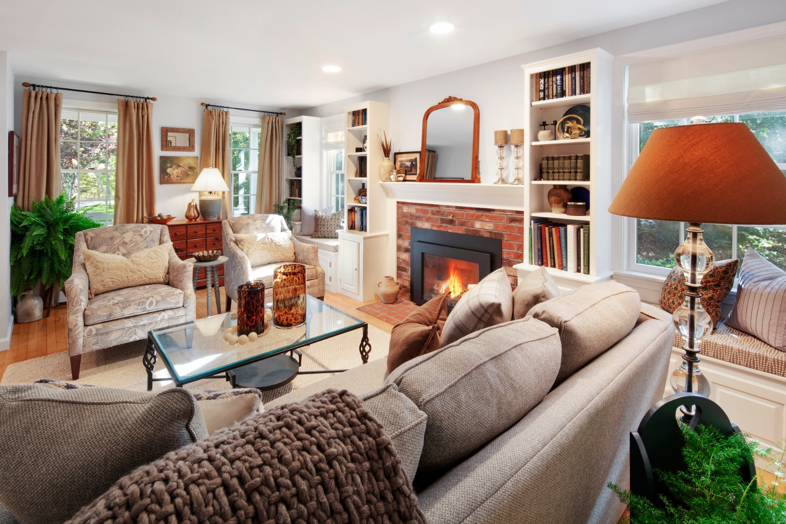 46 Bold Meadow Road Edgartown, MA 02539 - Photo 6 of 28 a living room with furniture a chandelier and a fireplace