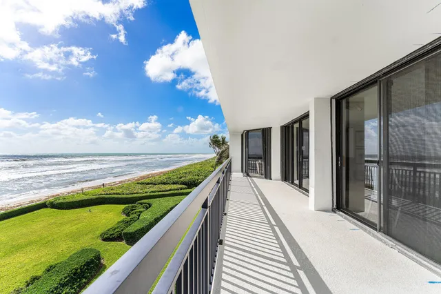a view of swimming pool with a balcony