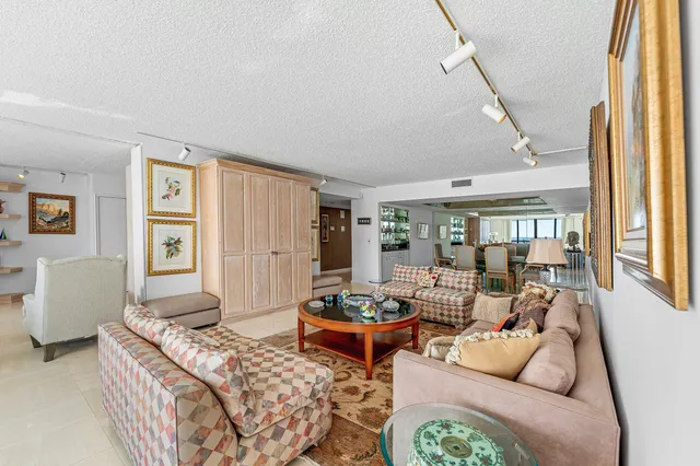 a living room with furniture and a table