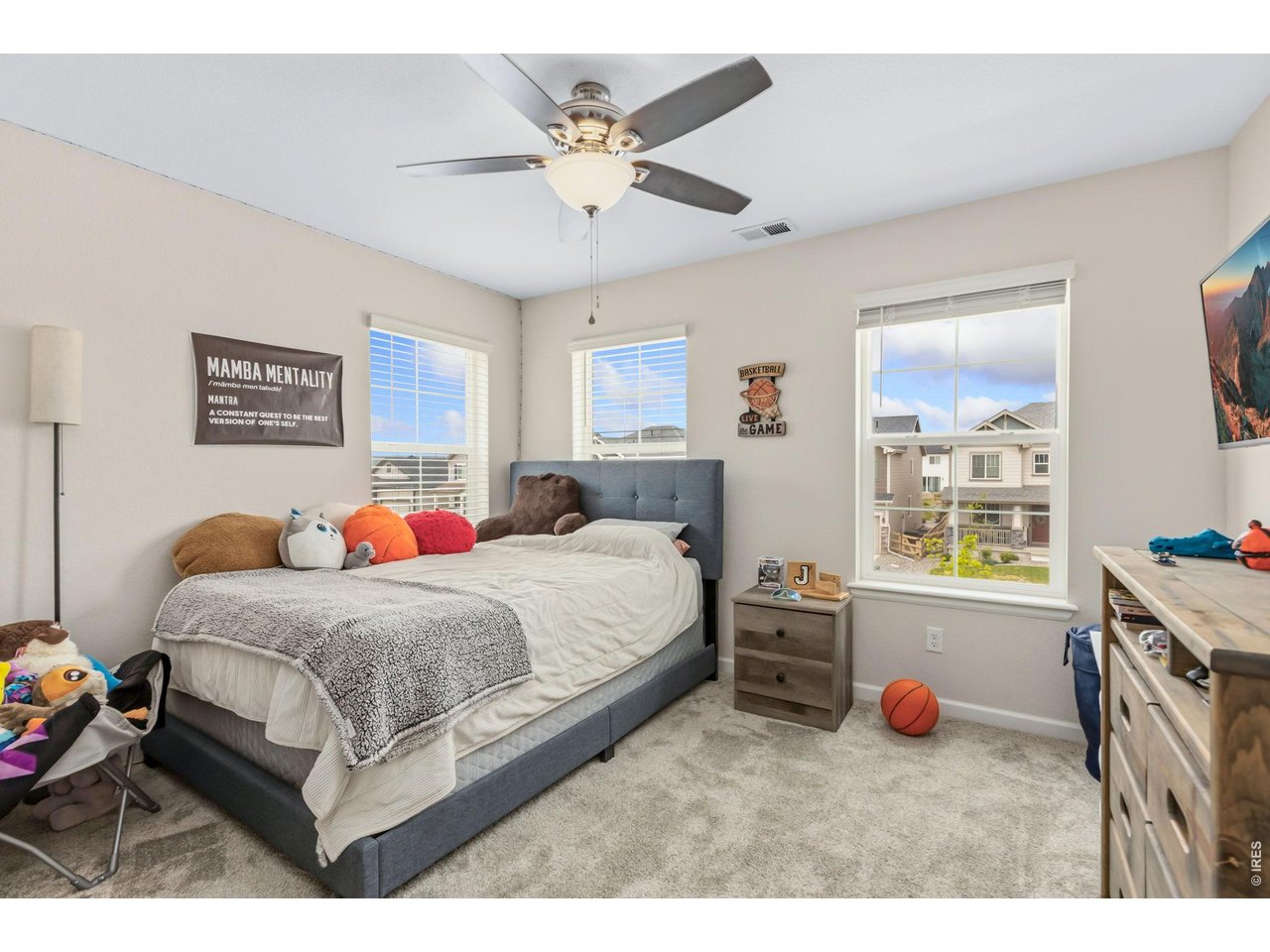 955 Rustling Street Windsor, CO 80550 - Photo 19 of 34 a bedroom with a bed and a window
