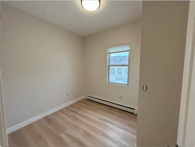 a view of a room that has a window in it